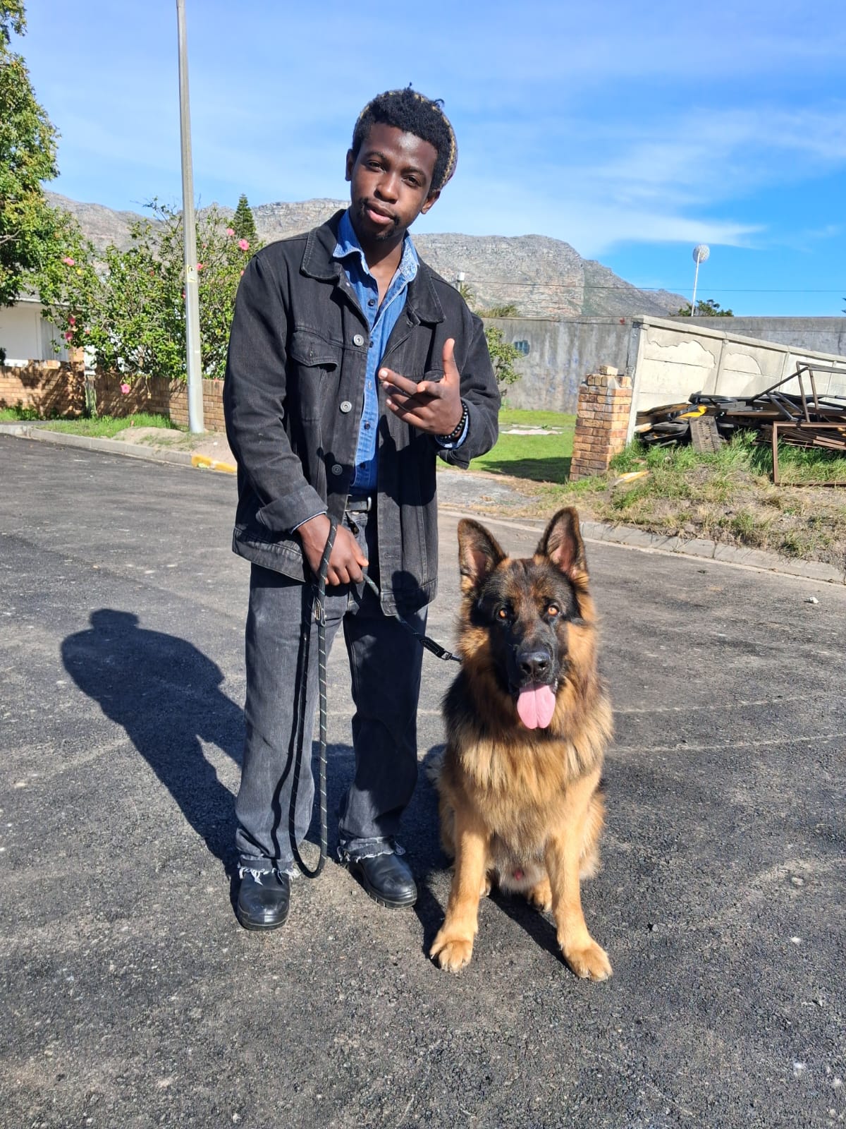 Leeroy Junior Chikwenya with a dog